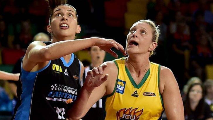 Canberra centre Marianna Tolo (left) will look to keep Suzy Batkovic at bay when the Capitals host Townsville on Saturday.  Photo: Alix Sweeney (Townsville Bulletin)