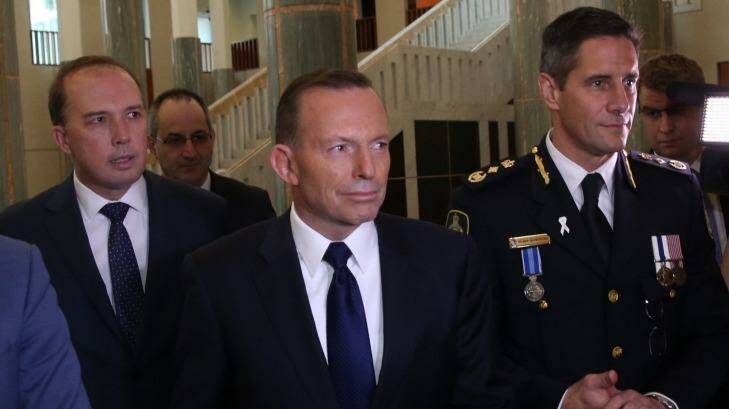 Immigration Minister Peter Dutton and Prime Minister Tony Abbott attend the swearing in ceremony of the inaugural Border Force commissioner Roman Quaedvliegn. Photo: Andrew Meares