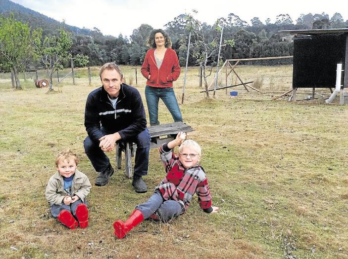 Melissa and Andrew Lubke with their children Archer, 3, and Jezeriah, 5, on their Lilydale property.