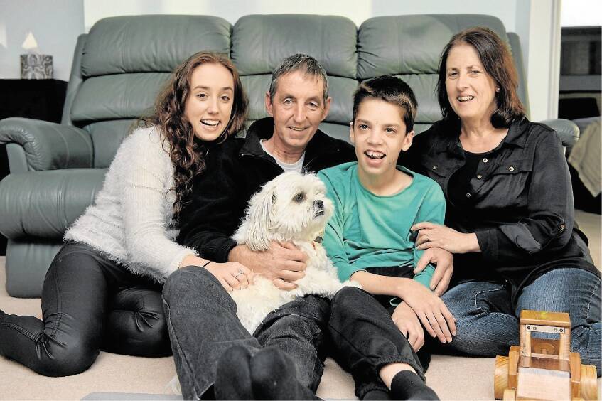 John Spencer and wife Cindy with their children Kate, 19, and Luke, 16, and their dog Dudley, all of Prospect. Picture: PAUL SCAMBLER