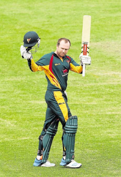 SYDNEY, AUSTRALIA - OCTOBER 18:  Ben Dunk of the Tigers celebrates and acknowledges the crowd after scoring 150 during the Matador BBQs One Day Cup match between Queensland and Tasmania at North Sydney Oval on October 18, 2014 in Sydney, Australia.  (Photo by Matt King/Getty Images)