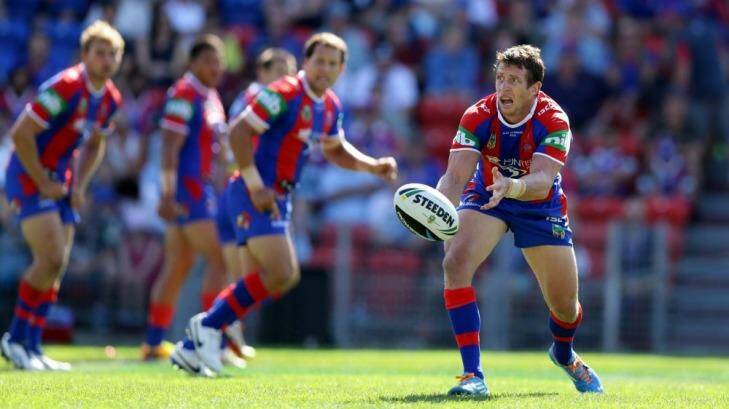 Playing for Alex: Knights captain Kurt Gidley gets a pass away against the Sharks last week. Photo: Jonathan Carroll