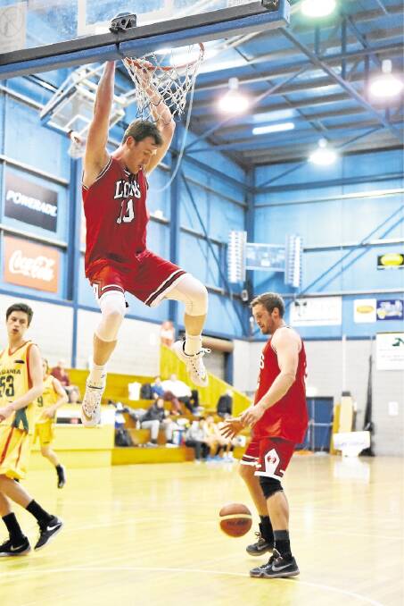 Dylan Warren puts down a slam dunk. Picture: Scott Gelston. 
