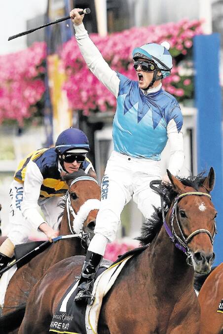 Zac Purton, riding Admire Rakti, wins the Caulfield Cup yesterday. Picture: GETTY IMAGES