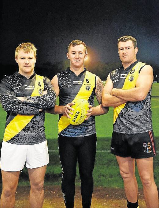 Rocherlea players Lyndon Stubbs, Sam Bannister and Darren Woodward sport the club's special playing strips for the NTFA Indigenous round this weekend. Picture: SCOTT GELSTON