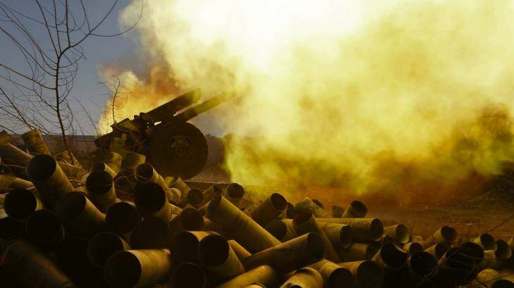 Conflict: Pro-Russian rebels fire artillery toward Ukrainian positions at Donetsk airport. Photo: Dmitry Lovetsky