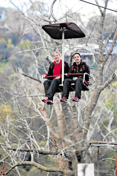 Welsh netball vice-captain Rosie Pretorius and captain Suzy Drane on the chairlift across Cataract Gorge. Picture: PHILLIP BIGGS