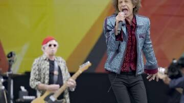 Mick Jagger and the Rolling Stones perform during the New Orleans Jazz and Heritage Festival. (AP PHOTO)