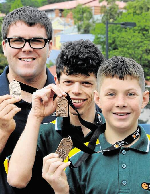 SLAM DUNK: Joshua Cleary, Nicholas Heames and Jeremiah Lowe proudly display their bronze medals from the national championships. Picture: NEIL RICHARDSON
