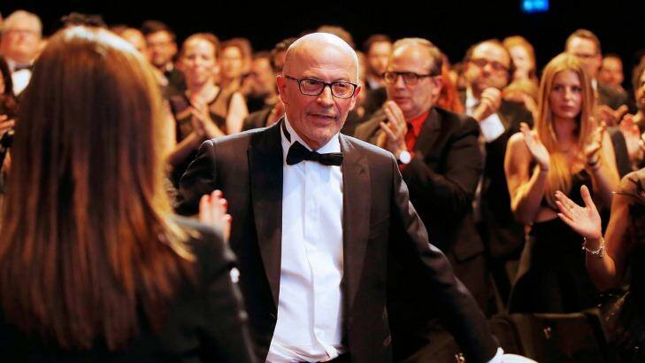 French director Jacques Audiard reacts after being awarded with the Palme d'Or. Photo: Valery Hache