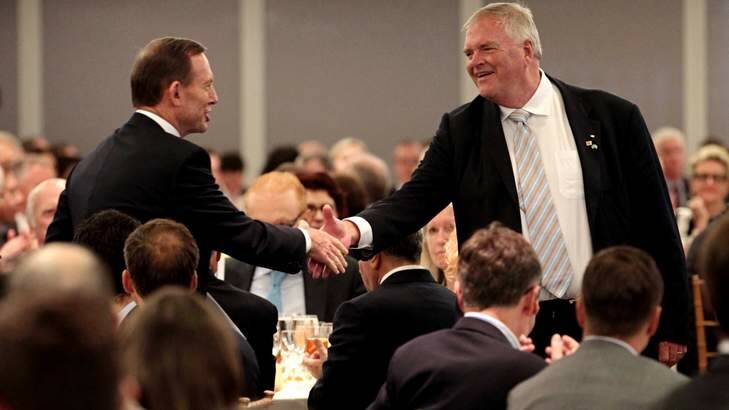 Prime Minister Tony Abbott greeted Ambassador Kim Beazley before a speech to the American Australian Association in New York. Mr Beazley, a former Labor leader, has had his term as ambassador extended. Photo: Andrew Meares
