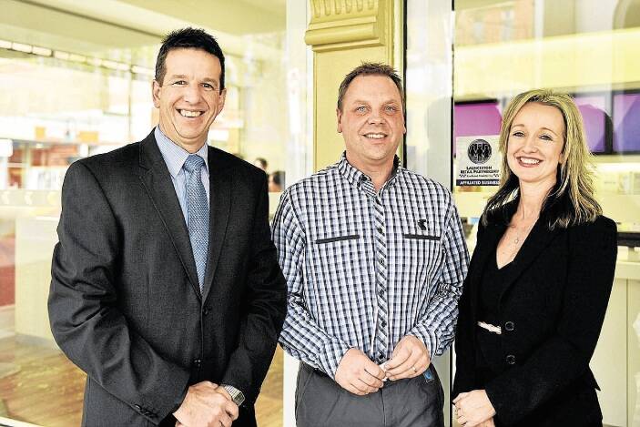 Andrew Doyle and Wayne Rohde, of the Telstra Store in the Quadrant Mall, with Cityprom's Vanessa Cahoon at the launch of the Launceston Retail Partnership on Friday. Picture: SCOTT GELSTON
