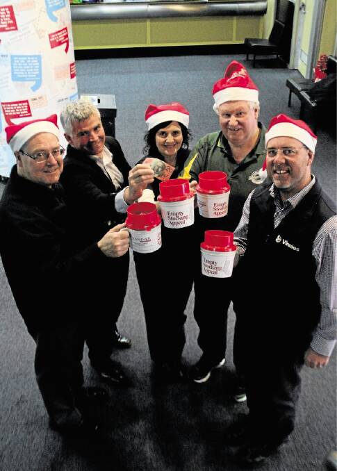 City Mission fund-raising manager Brian Roach, The Examiner's Matt Wilson, Salvation Army Doorways facilitator Kelly Brown, Benevolent Society chief executive John Stuart and St Vincent de Paul Northern region manager Peter Freak launch the 2014 Empty Stocking Appeal. Picture: ALEX DRUCE