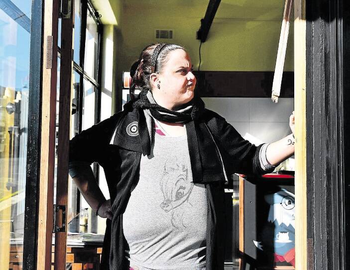 Badger and Boots part-owner Liz Corrick surveys the damage to her cafe after it was targeted by thieves. Picture: NEIL RICHARDSON