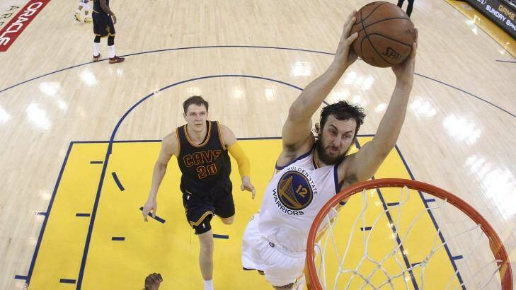 Back in national colours: Golden State Warriors centre Andrew Bogut dunks against the Cleveland Cavaliers during the NBA Finals. Photo: Ezra Shaw