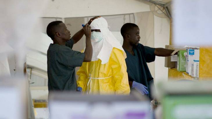 Those combating Ebola in West Africa will soon be joined by 17 Australian health workers. Photo: AFP 