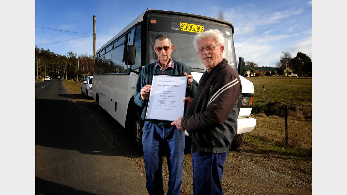 Bus owner Ian Miller and bus driver Henry Jacobs. Picture: GEOFF ROBSON.