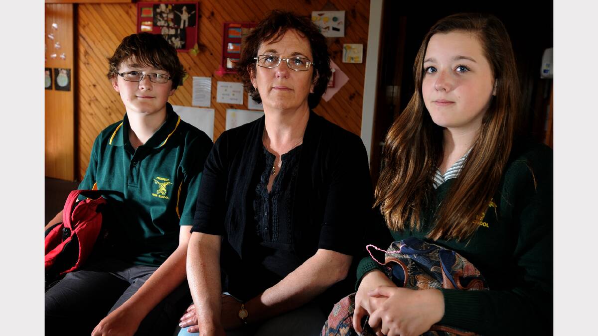 Mazine Burr, of prospect, with her children Luke and Lydia, both 14, is angry that the government has made tomorrow a student-free day. Picture: Geoff Robson