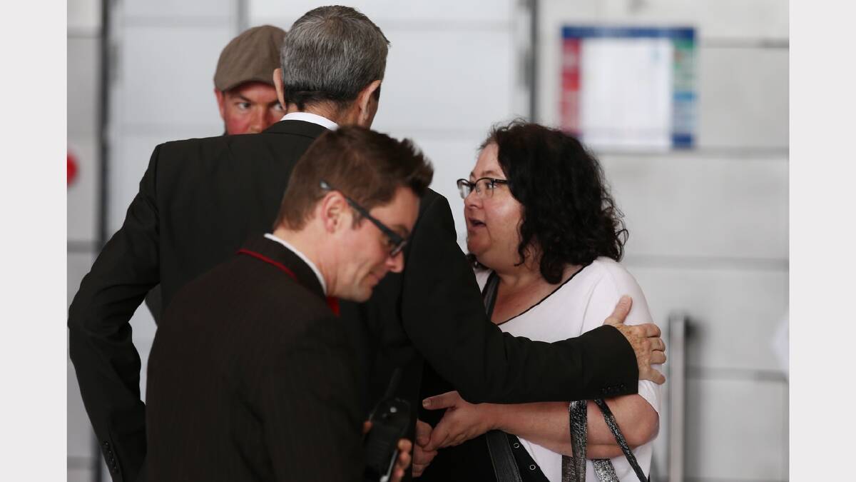 Emma Parkinson's mother Lisa is greeted by an Australian embassy official on arrival in Paris. Picture: FAIRFAX MEDIA