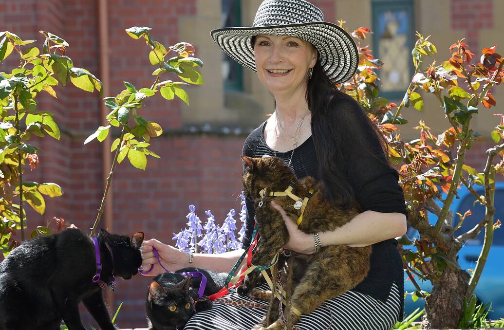 Diane Jewson with Saskia, who turned 19 on Saturday, and Seb and Sabrina, at the Blessing of the Animals at Launceston's Holy Trinity Church. Picture: PHILLIP BIGGS
