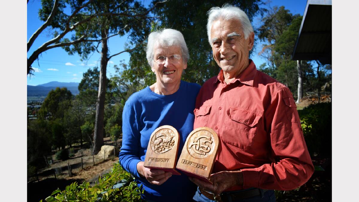 Virginia and Bill Greenhill with a pair of Nellie Payne bookends made for Mr Greenhill's grandmother.