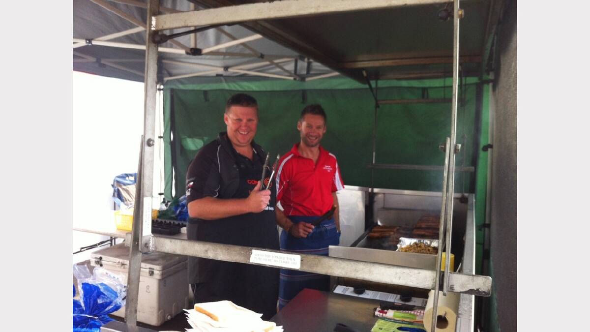 'From left Brett Gillow and Michael Harris cooking sausages at Bunnings on Sunday, raising money for Youngtown little athletics club'. Sent in by Nigel Freestone