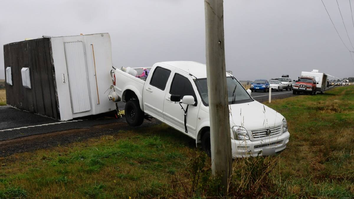 A caravan flipped on the Midland Highway near Campbell Town yesterday. Picture: Neil Richardson