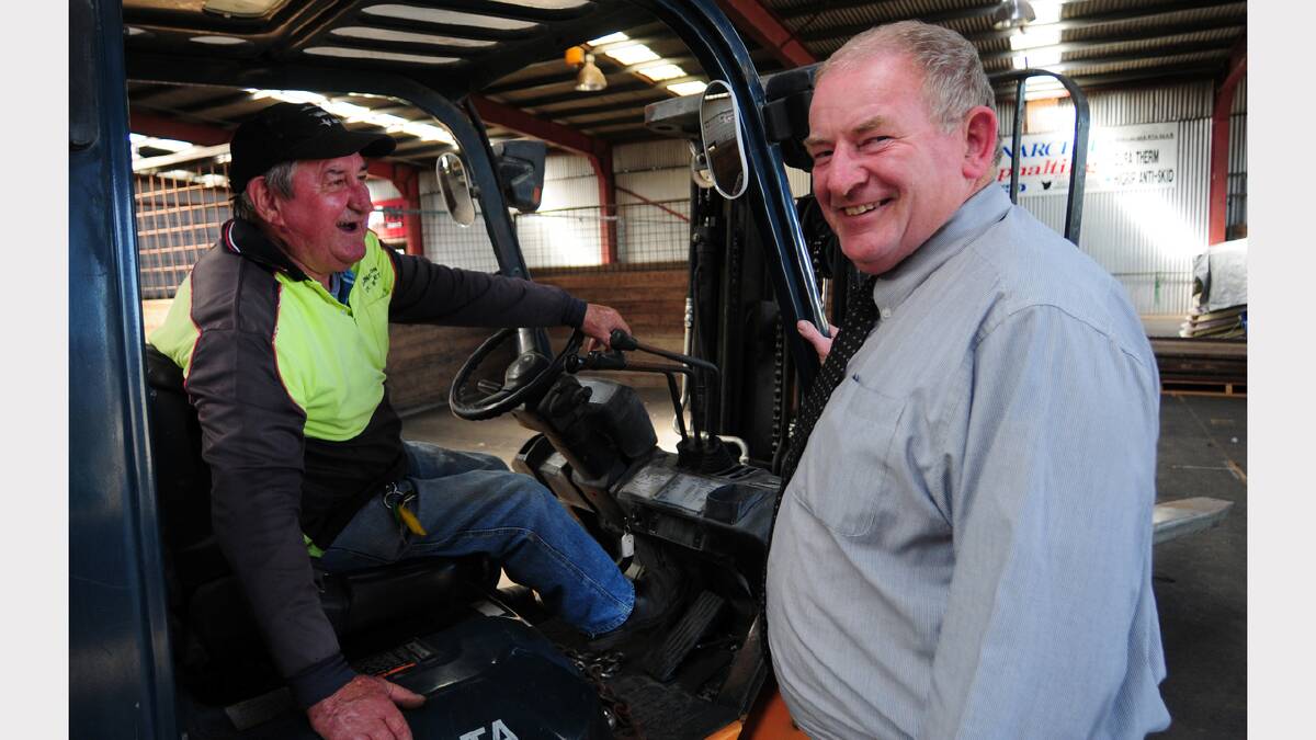 Forklift operator Greg Wilcox and show chief executive Brian Bennett discuss the accommodation of the animal nursery in the cattle pavilion's indoor arena. The show runs on Thursday, Friday and Saturday next week. Picture: PETER SANDERS