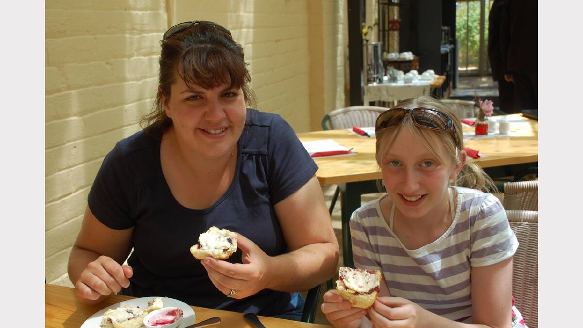 Ruth Schwartz and her daughter Hannah, 12, enjoy scones with jam and cream at the Clarendon House Cafe.