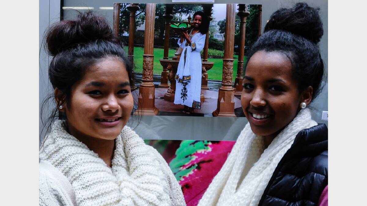 Zodinpui Bunghma, from Myanmar, and Rahel Mehri, from Eritrea, viewing entries at The Atrium, the Launceston General Hospital art gallery. Picture: Neil Richardson