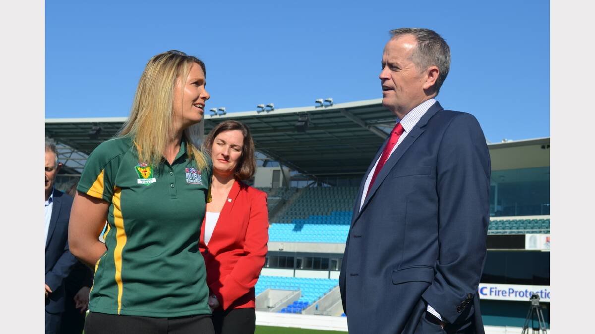 Opposition Leader Bill Shorten talks mental health with female footballer Kelly Dixon in Hobart on Friday morning.