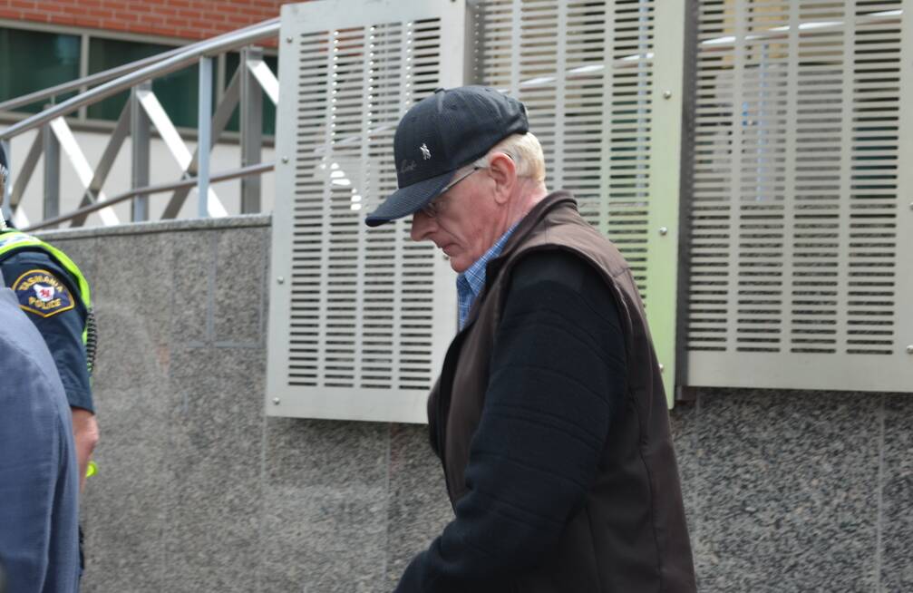 Geoffrey Charles Hunt leaves court in Hobart on Monday.