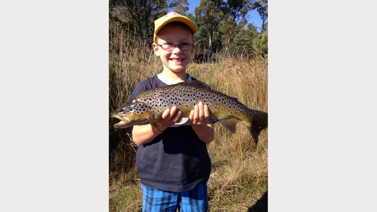 'Fishing at Four Springs. Caught a nice brown trout with a worm'. Sent in by Scott Hayes