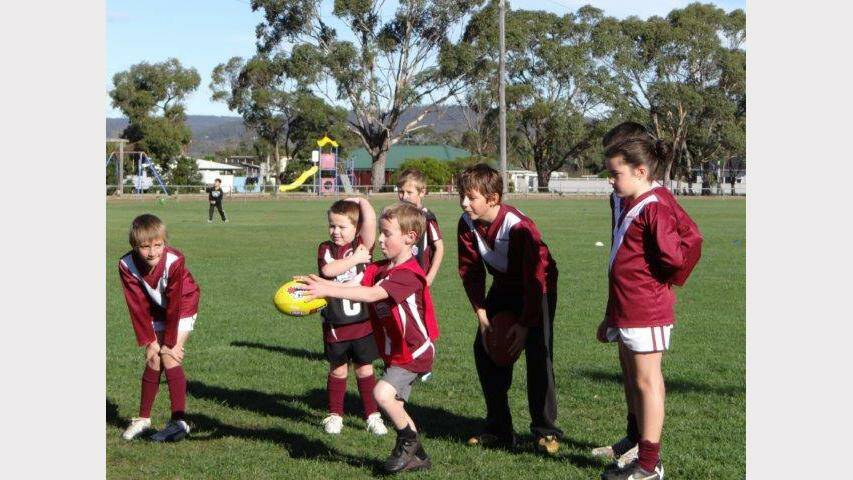 Triabunna Junior Football Club members get ready for their first game of Auskick.