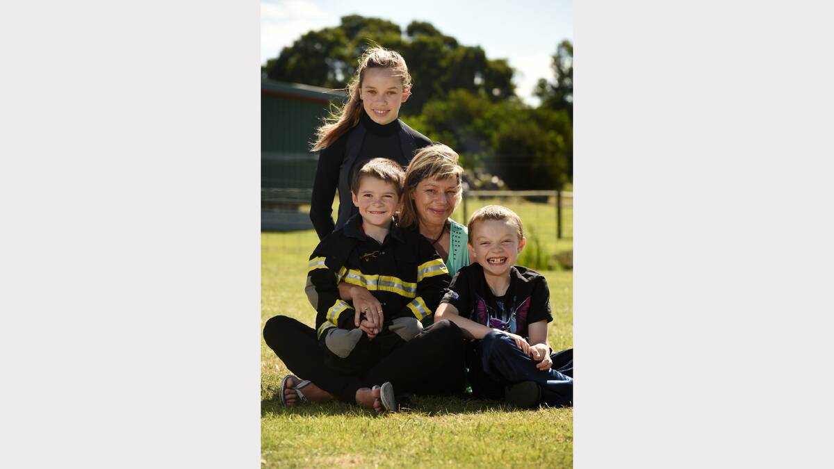 Ulverstone family Dakoda, 12, Trystan, 6, and Ethan Stephens, 8, with mum Jodi Revell at the Port Sorell Camp Quality summer camp. Picture: MARK JESSER
