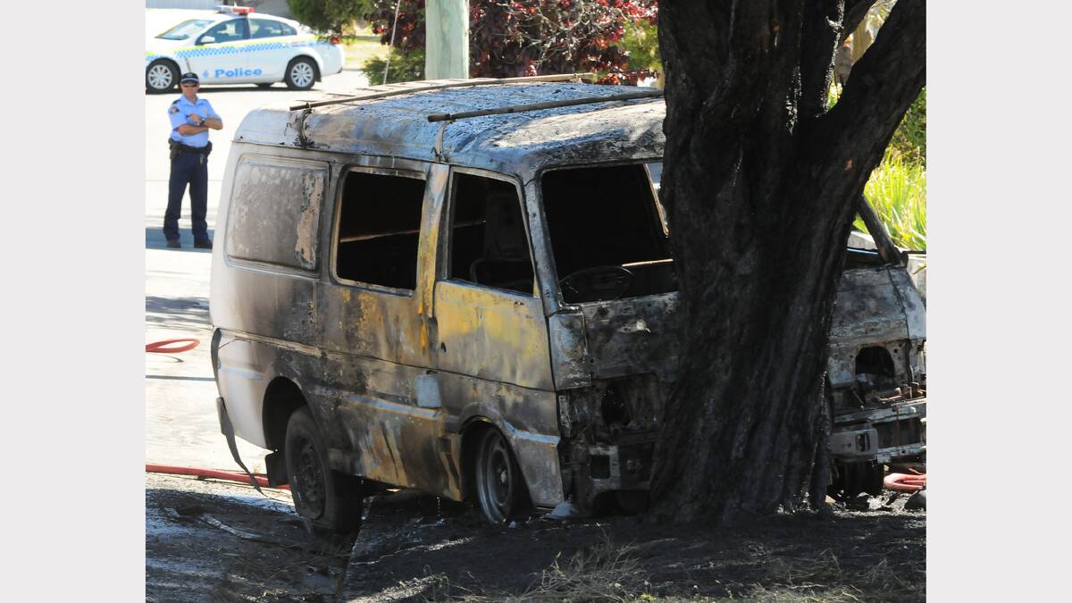 The blackened remains of the van that mysteriously caught fire, charged down McDougall Street, Kings Meadows, and crashed into a tree. Picture: NEIL RICHARDSON