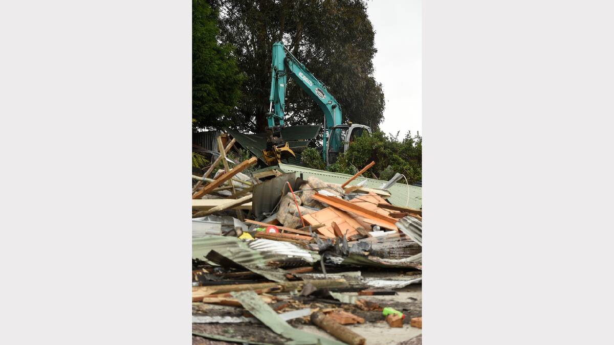 Vandals on an excavator destroyed what was left of a Frankford home that had been damaged by fire. Picture: Mark Jesser