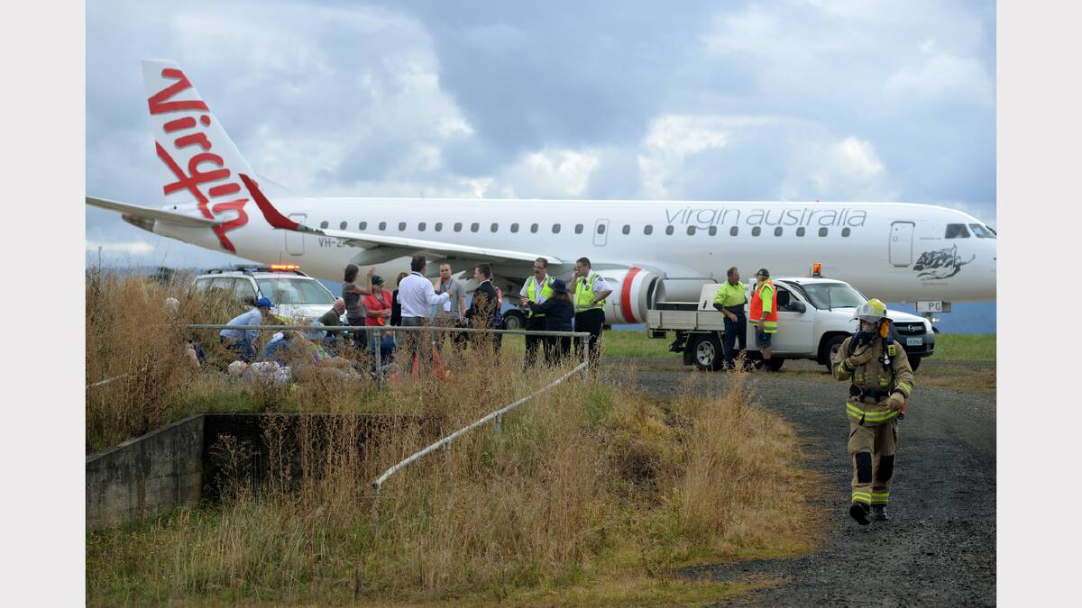 Emergency services and volunteer passengers took part in a mock plane crash at the Launceston Airport yesterday. Picture: Mark Jesser