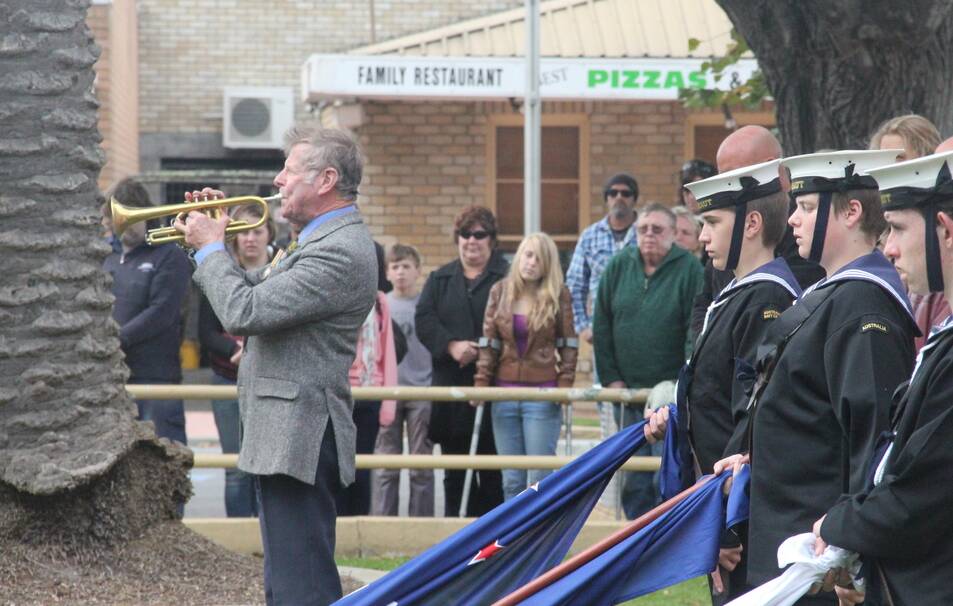 Bruce Haley, pictured playing the bugle at St Helens Anzac Day commemorations in 2012.