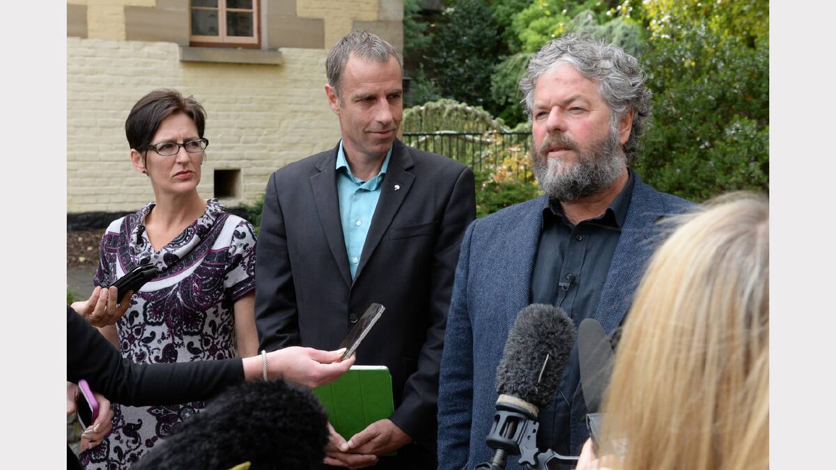 Cassy O'Connor and Nick McKim watch as Kim Booth addresses the media in Launceston yesterday. Picture: Mark Jesser