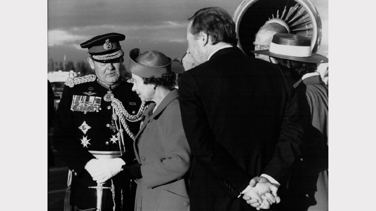 Queen Elizabeth and Prince Philip's 1988 royal visit | The Queen has a word to Sir Phillip Bennett, Governer of Tasmania, at the Hobart airport.
