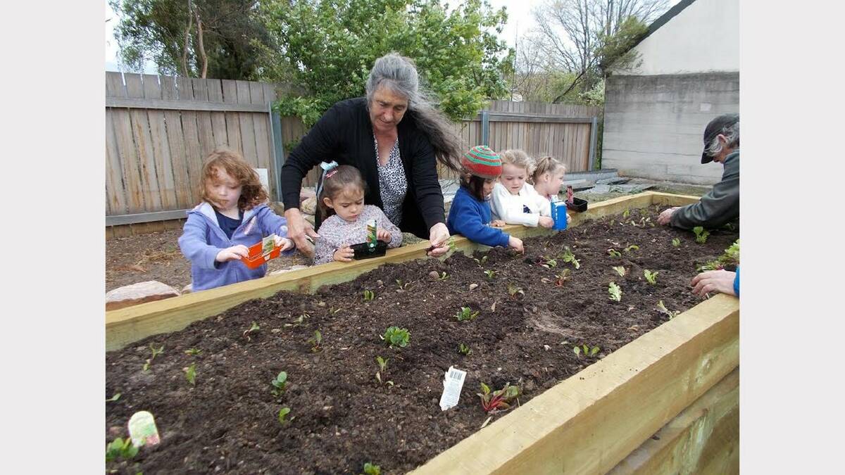 Volunteers help out at Fingal Valley Neighbourhood House community garden.