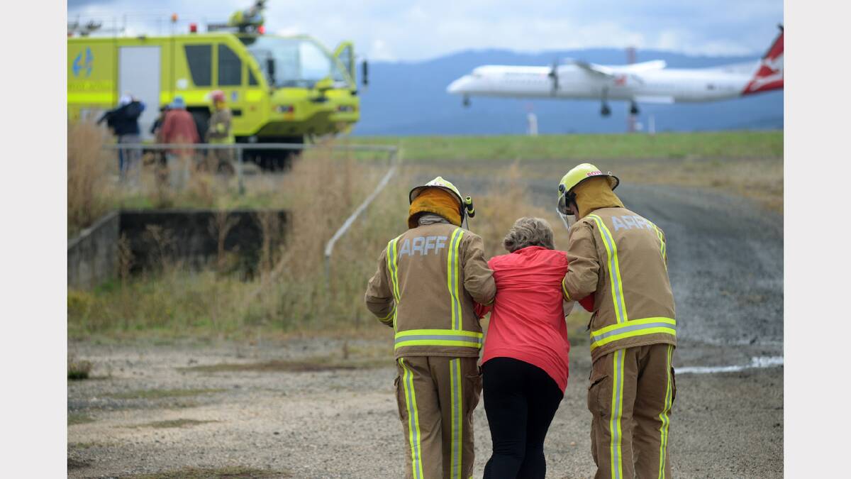 Emergency services and volunteer passengers took part in a mock plane crash at the Launceston Airport yesterday. Picture: Mark Jesser