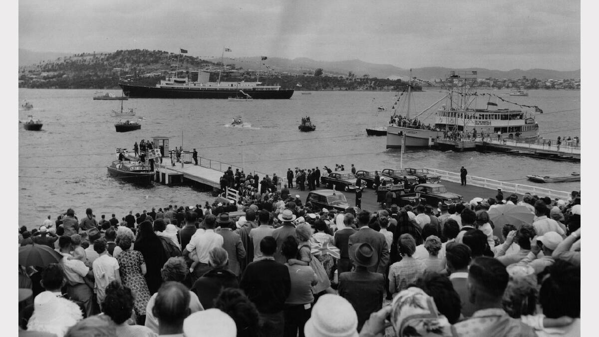 Queen Elizabeth and Prince Philip's 1963 royal visit | The overall picture at the Hobart Regatta grounds as the Queen prepares to step ashore from the Royal barge.