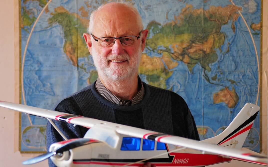 Robin Frith with a model of the Cessna he flew from the US to Australia with his family 40 years ago. Picture: PHILLIP BIGGS