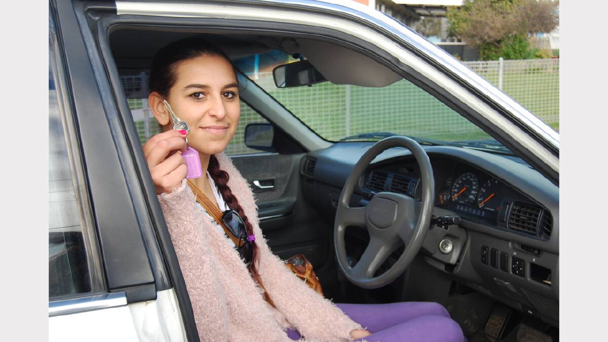 Behind the wheel ... Keomy Mansell holds the keys to her new car.