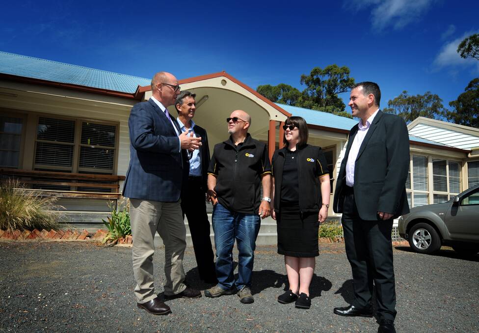 Member for Lyons Eric Hutchinson, City Mission's John Clements, Rob and Anne Koops from Missiondale, with City Mission chief executive Stephen Brown, celebrate the $500,000 funding for the centre. Picture: GEOFF ROBSON 

