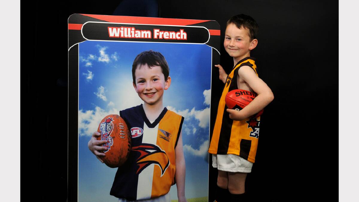 Six-year-old William French, of Whitemore, presented a medal to Grant Birchall at the AFL Grand Final. Picture: GEOFF ROBSON