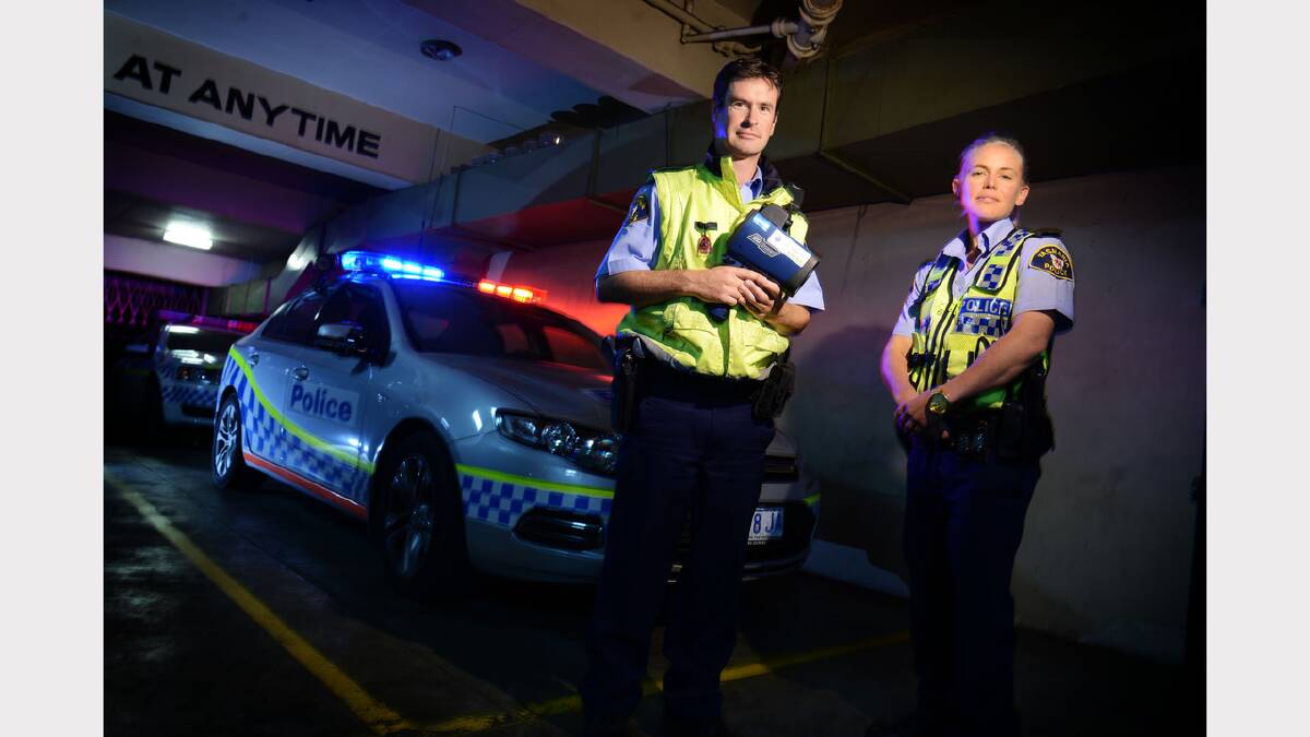 Constable Paul Beaumont and Senior Constable Skye Carey gear up for Operation Crossroads - the road safety blitz that runs state-wide across the Easter long weekend. Picture: Scott Gelston