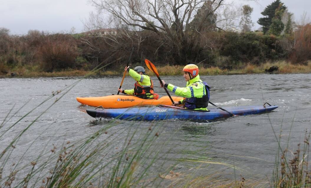 Police kayakers search the South Esk River on Monday morning. Picture: Neil Richardson